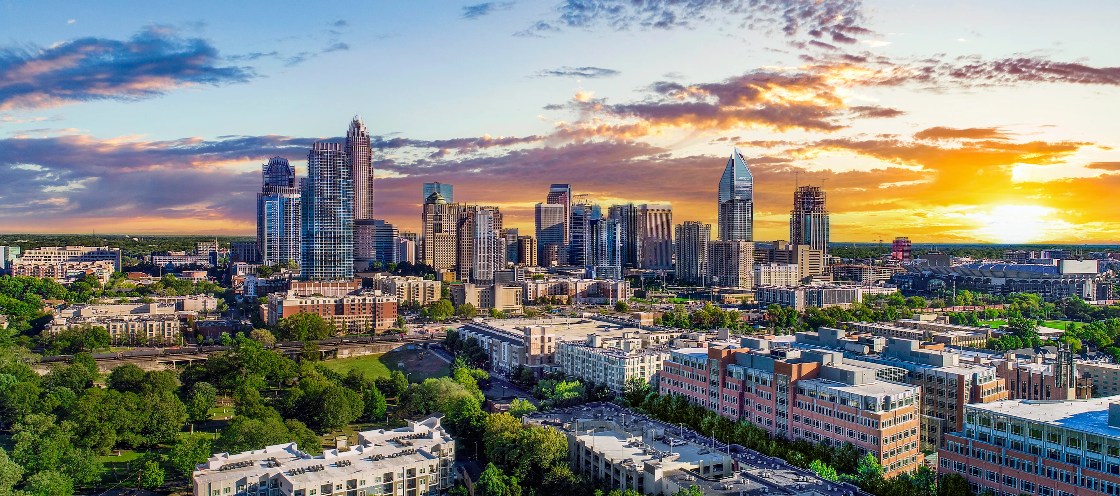 A city skyline with many buildings and trees.
