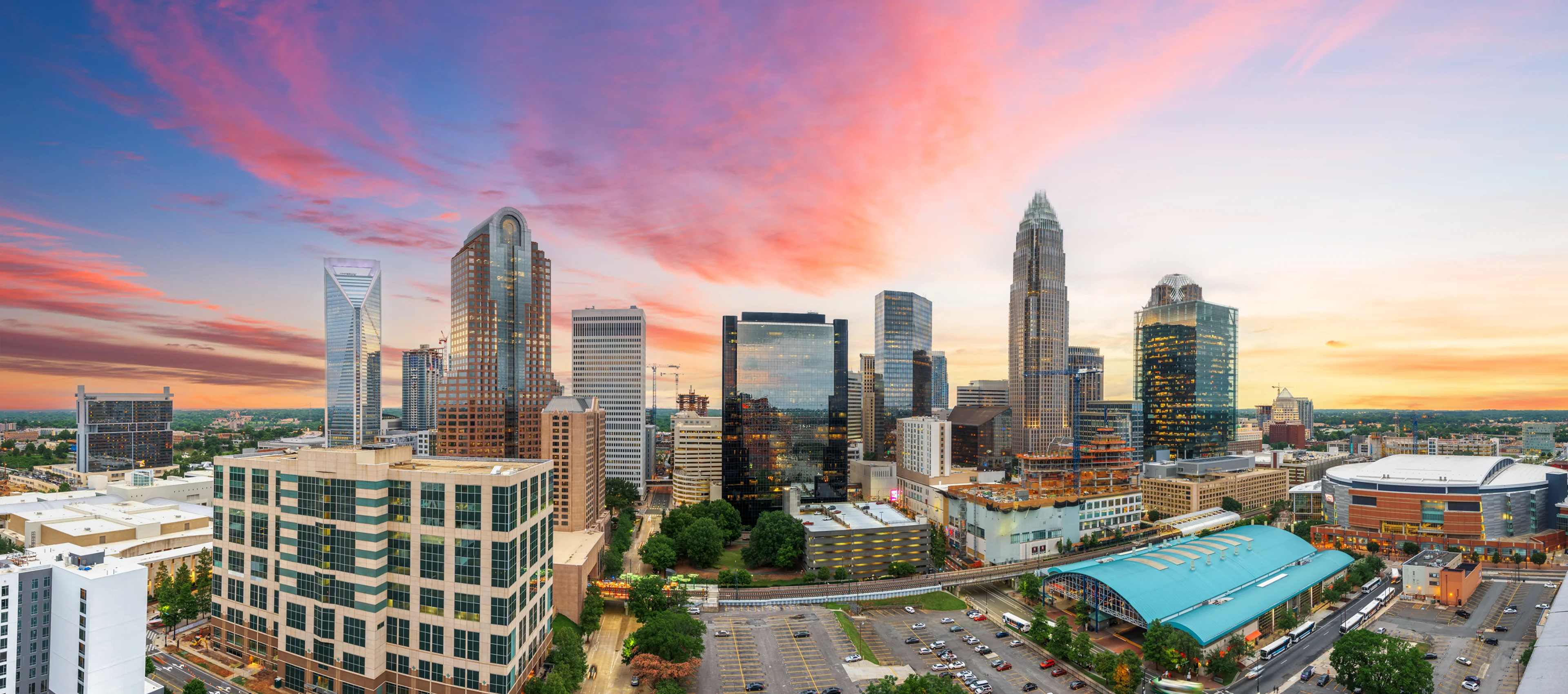 A view of the city skyline at sunset.